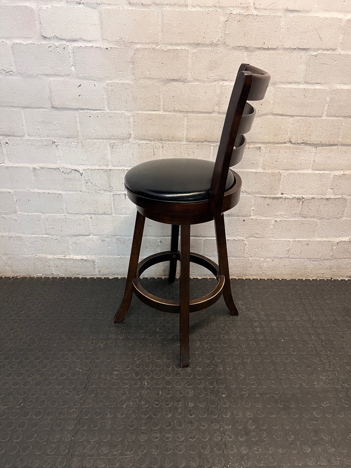 Dark Brown Wooden Bar Stool with Leather-Look Padded Seat — Frame Scuffs and Scratched Leather Seats – top view