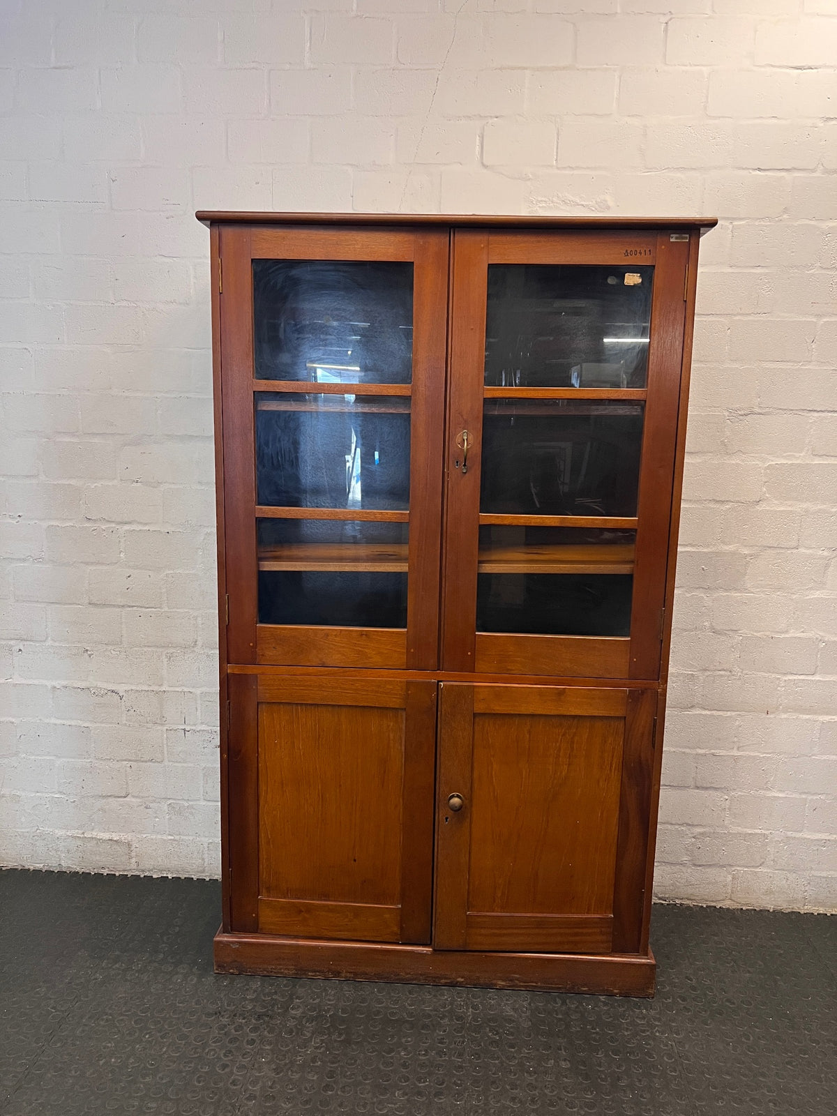Tall Wooden Glass-Front Display Cabinet — Water Damage Present – main front view