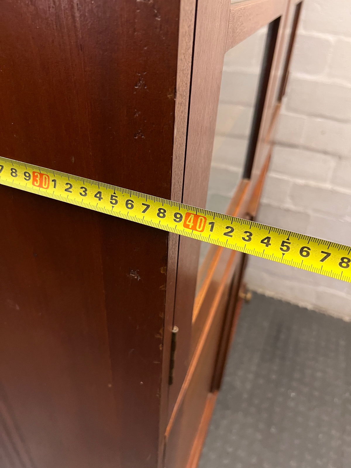Tall Wooden Glass-Front Display Cabinet — Water Damage Present – width measurement