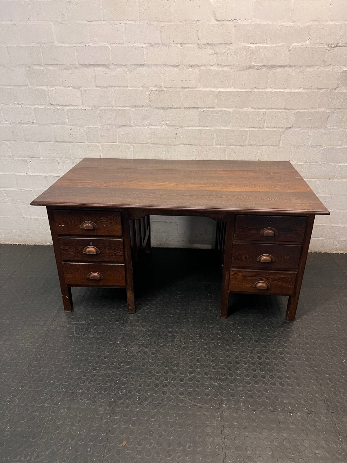Classic Pedestal Wooden Office Desk with Cup Handles — Loose Top Surface and Age-Related Wear – main front view