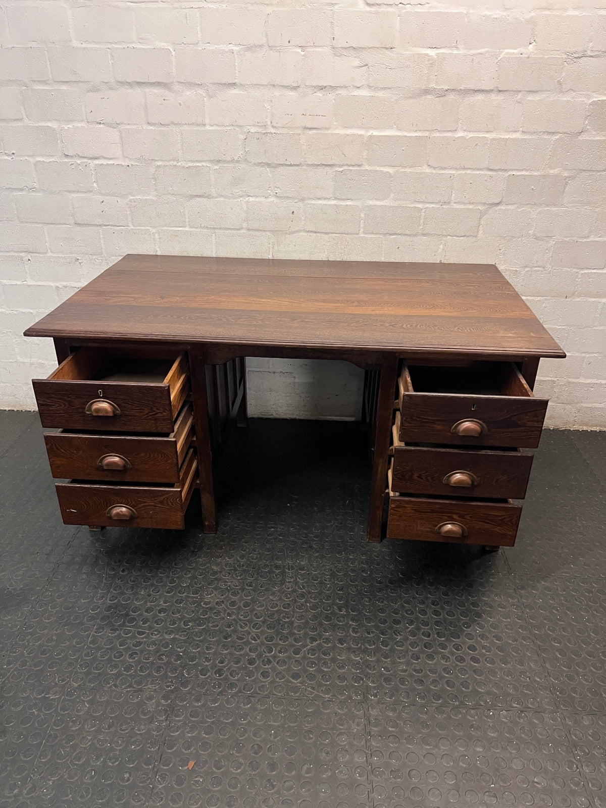 Classic Pedestal Wooden Office Desk with Cup Handles — Loose Top Surface and Age-Related Wear – side view