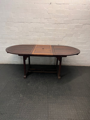Oval Trestle-Style Wooden Outdoor Dining Table — Aged Wood with Worn Surface Finish – main front view