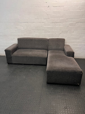 Grey Textured Fabric L-Shape Couch — Damaged and Worn Condition – main front view