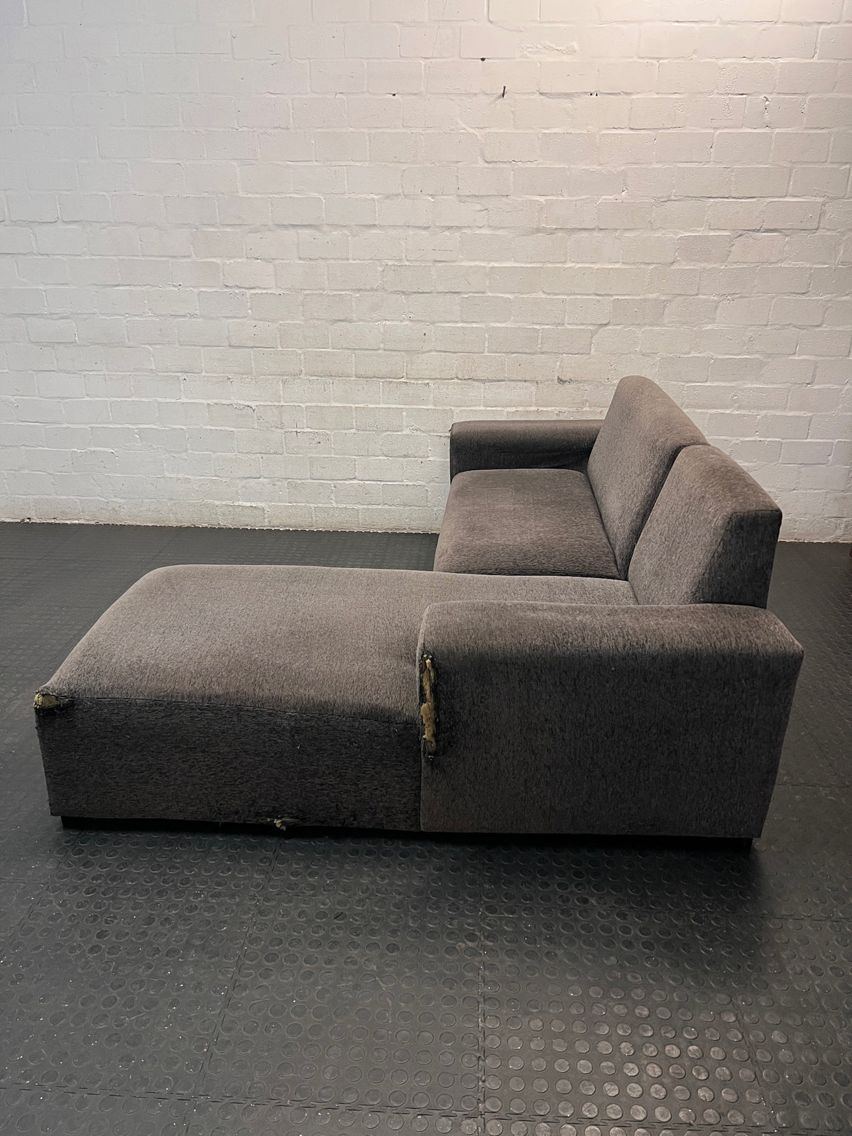 Grey Textured Fabric L-Shape Couch — Damaged and Worn Condition – side view