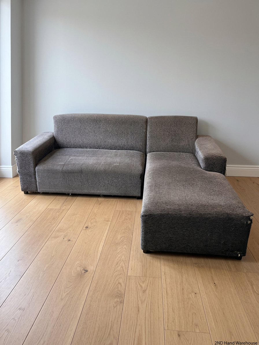 Grey Textured Fabric L-Shape Couch — Damaged and Worn Condition – styled product image