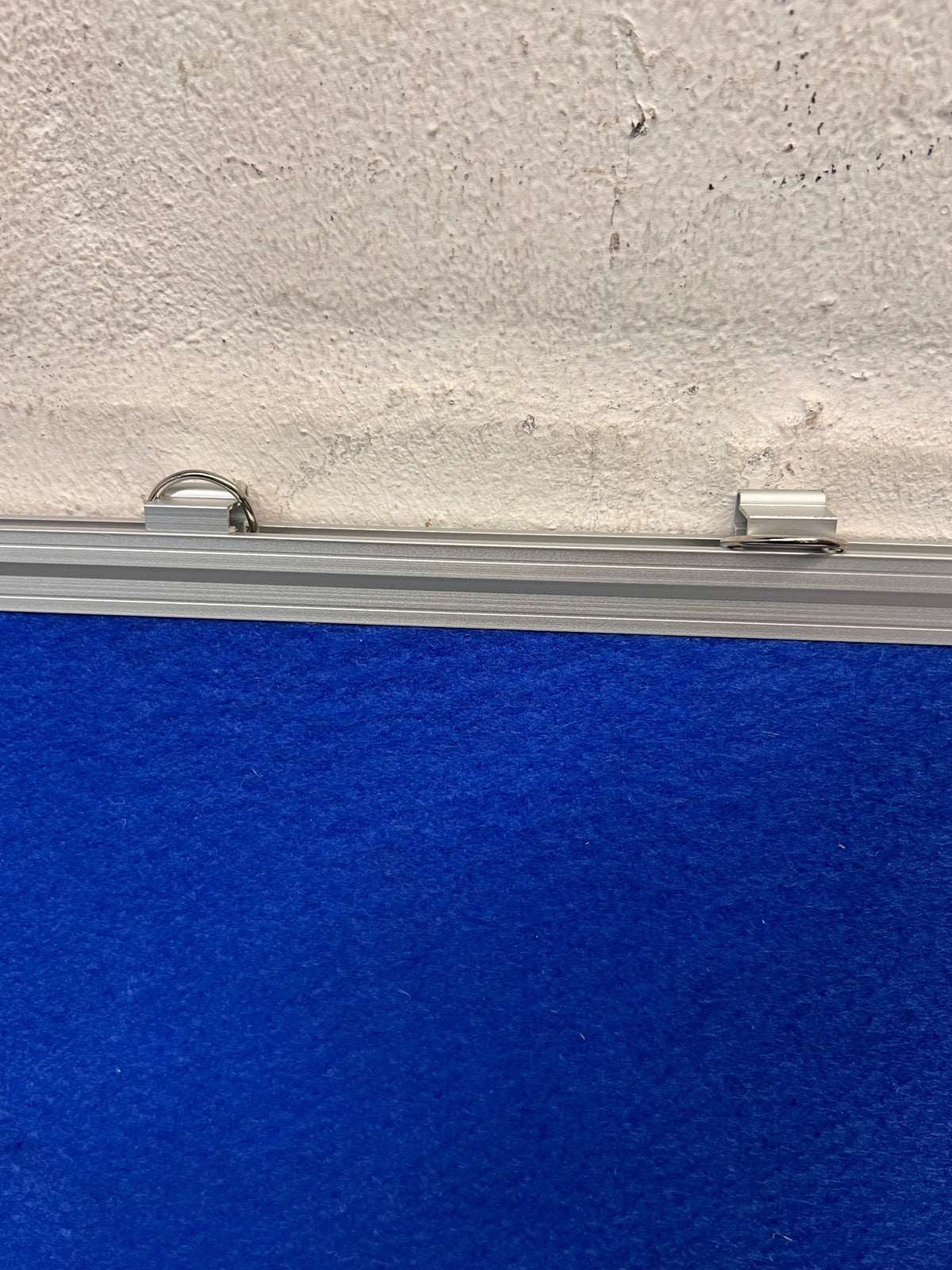 Blue Felt Pin Board with Aluminium Frame — Clean and Well-Maintained – side view