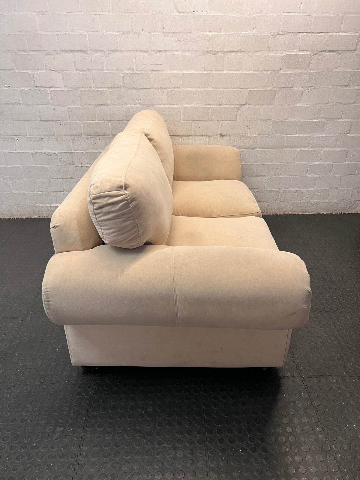 Beige Slouch Style 2 Seater Coricraft Couch — Small Mark on One Cushion – back view
