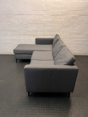 Santino Grey Fabric Fabric Corner Chaise Couch — Fabric Surface Has a Small Coal Burn – side view