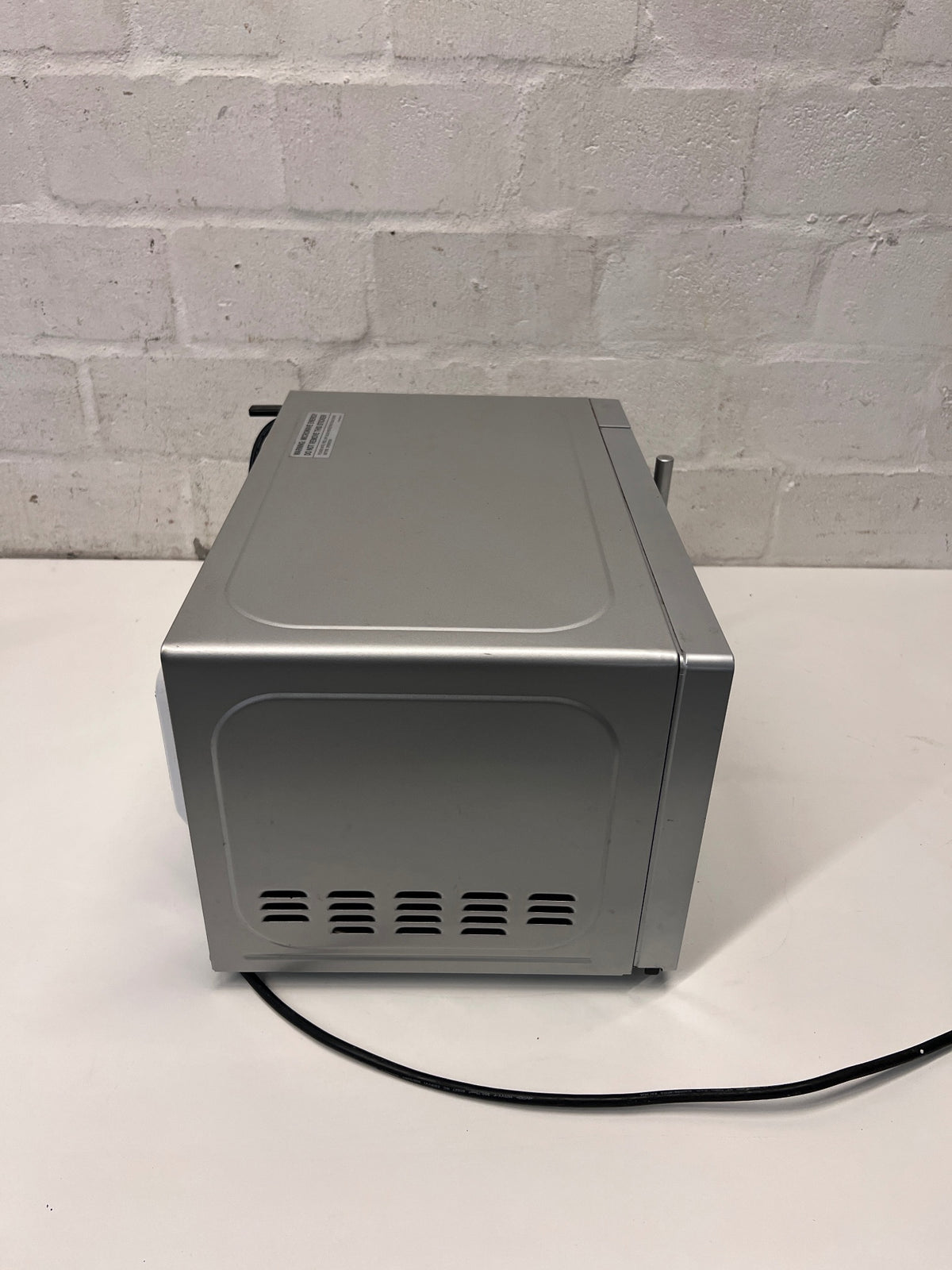 Silver Russell Hobbs Mirror Microwave — Working Well with Slight Surface Rust – top view