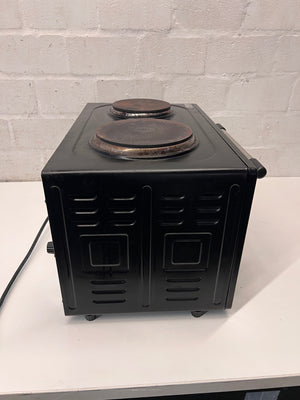 Black Fussion Two-Plate Countertop Stove and Oven — Working Order with Visible Rust – back view