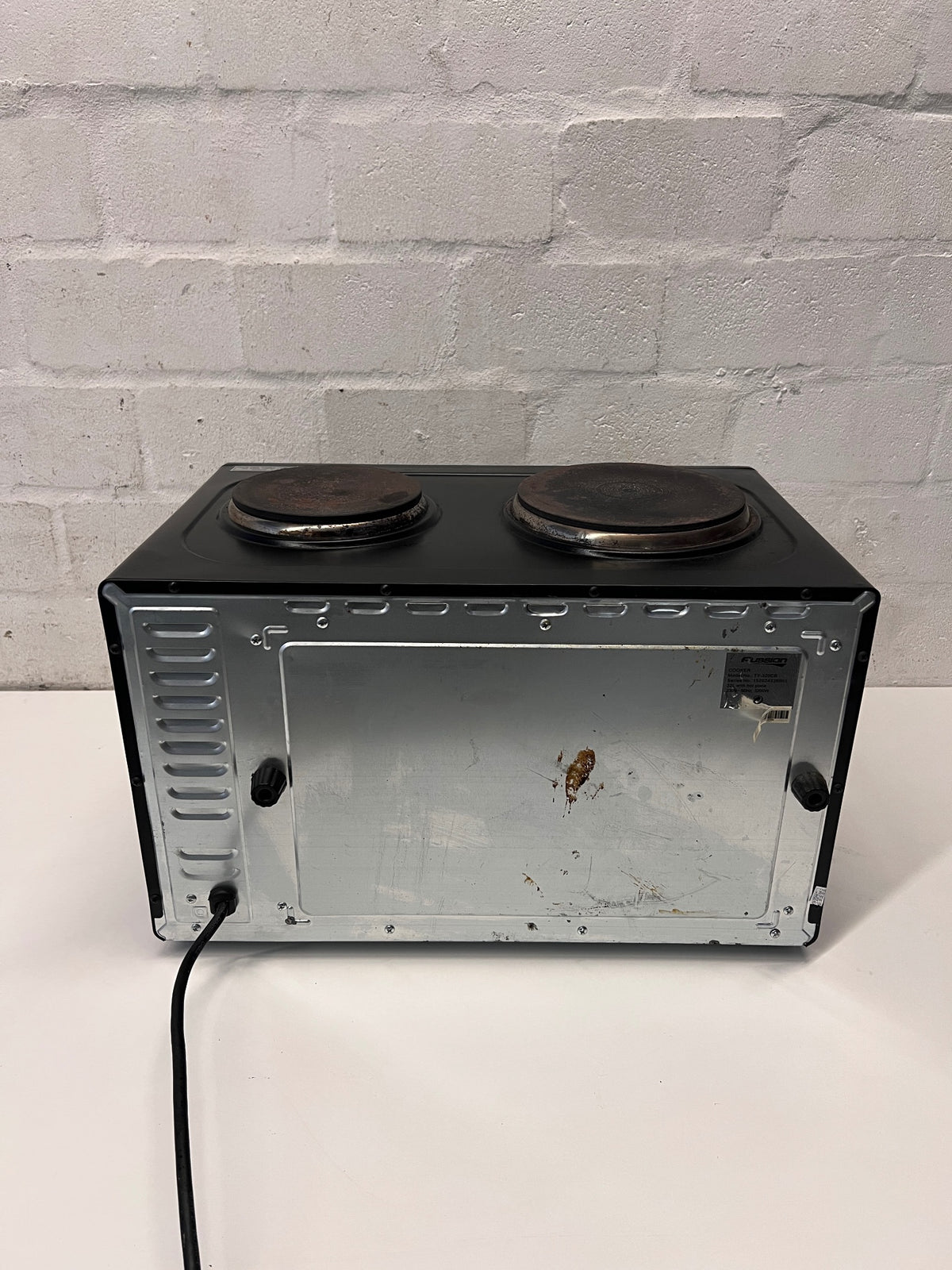 Black Fussion Two-Plate Countertop Stove and Oven — Working Order with Visible Rust – condition detail
