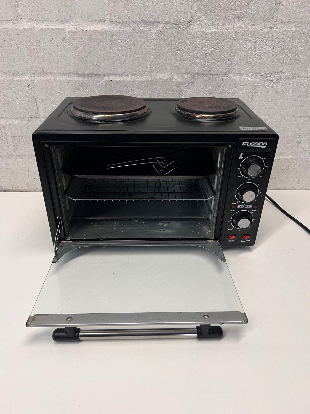 Black Fussion Two-Plate Countertop Stove and Oven — Working Order with Visible Rust – side view
