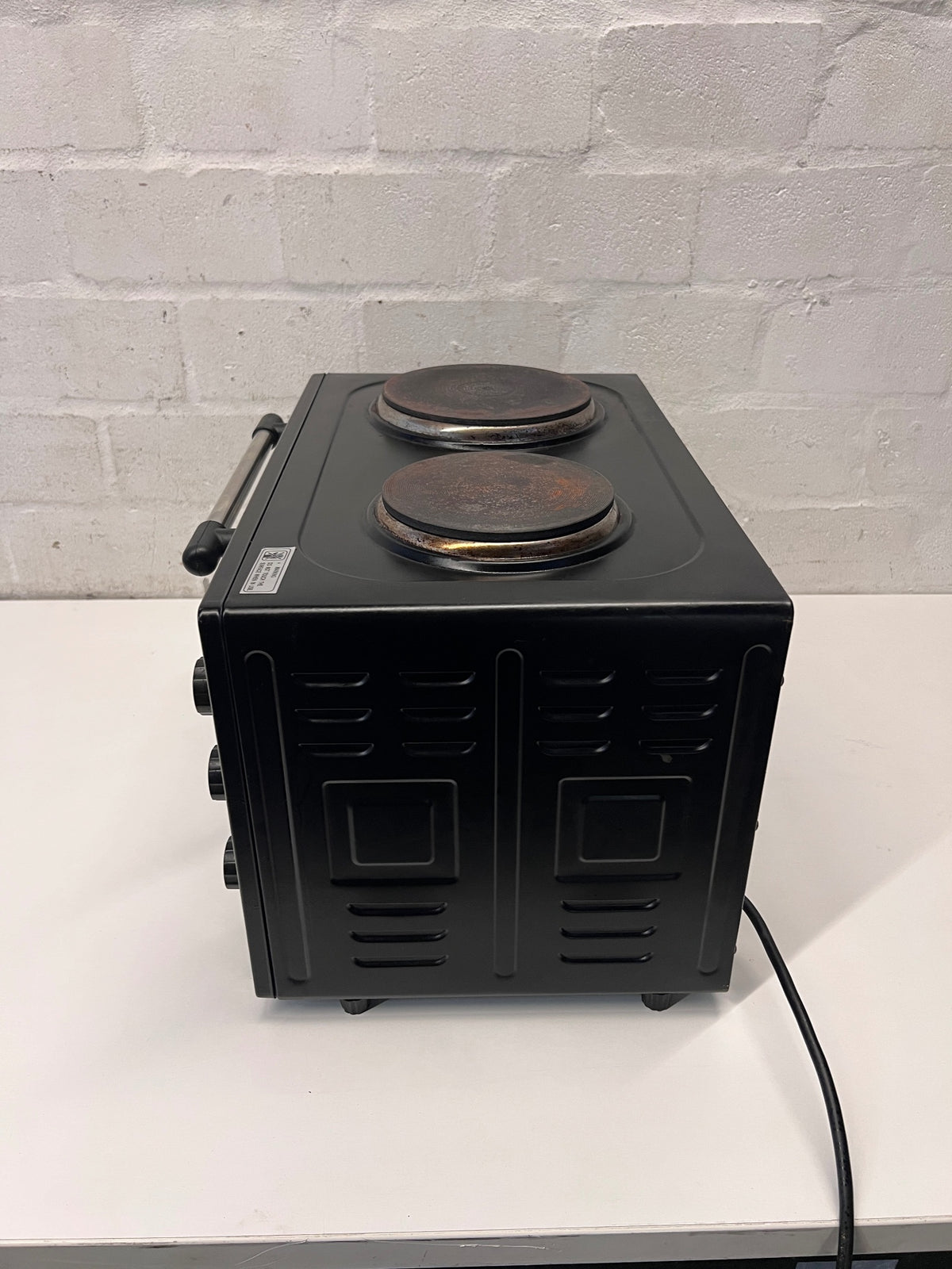 Black Fussion Two-Plate Countertop Stove and Oven — Working Order with Visible Rust – top view
