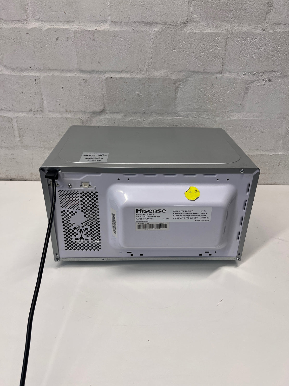 Hisense Silver Countertop Microwave with Mirrored Door — Good Working Order; Used Fair Condition – back view