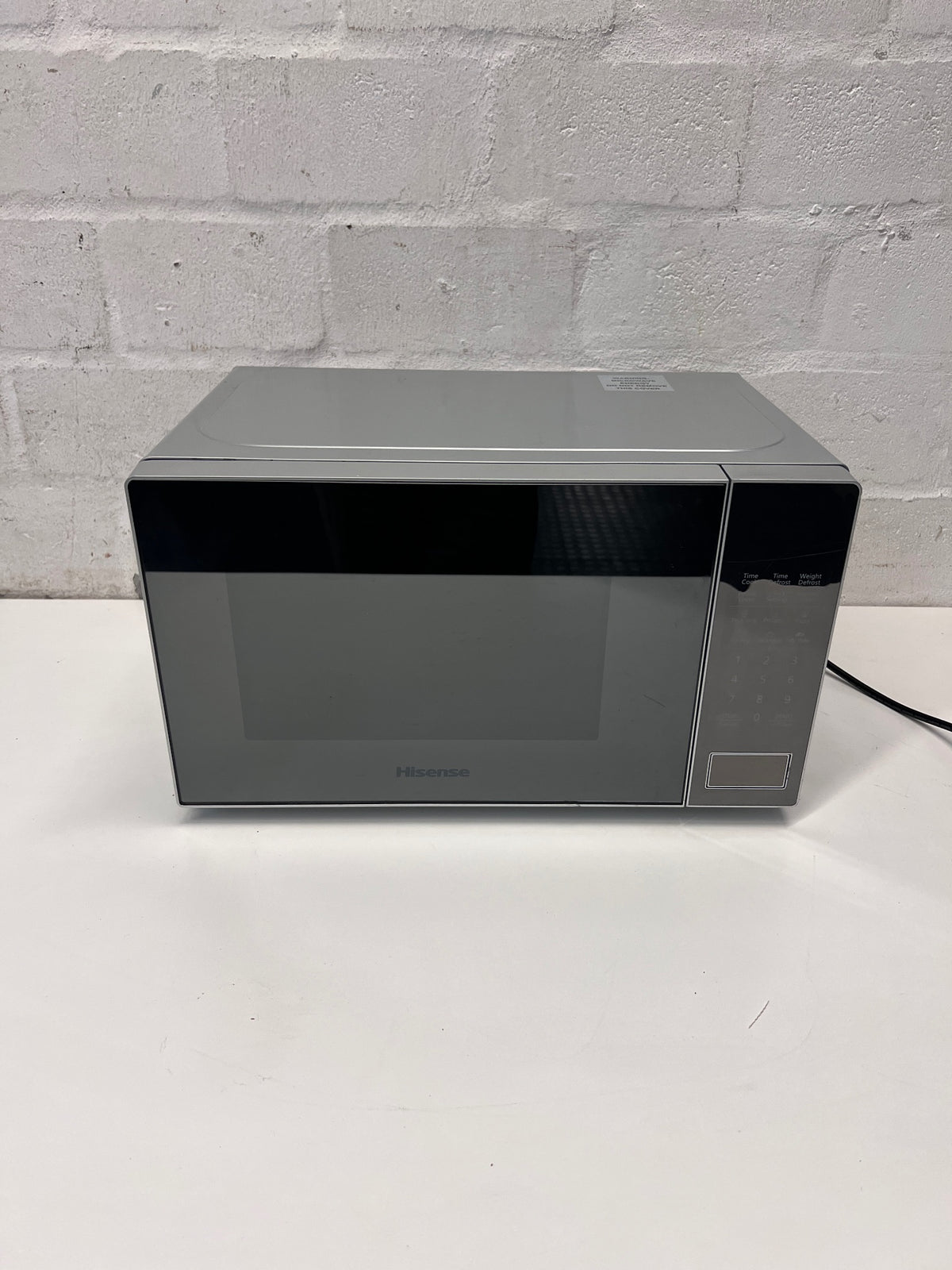 Hisense Silver Countertop Microwave with Mirrored Door — Good Working Order; Used Fair Condition – main front view