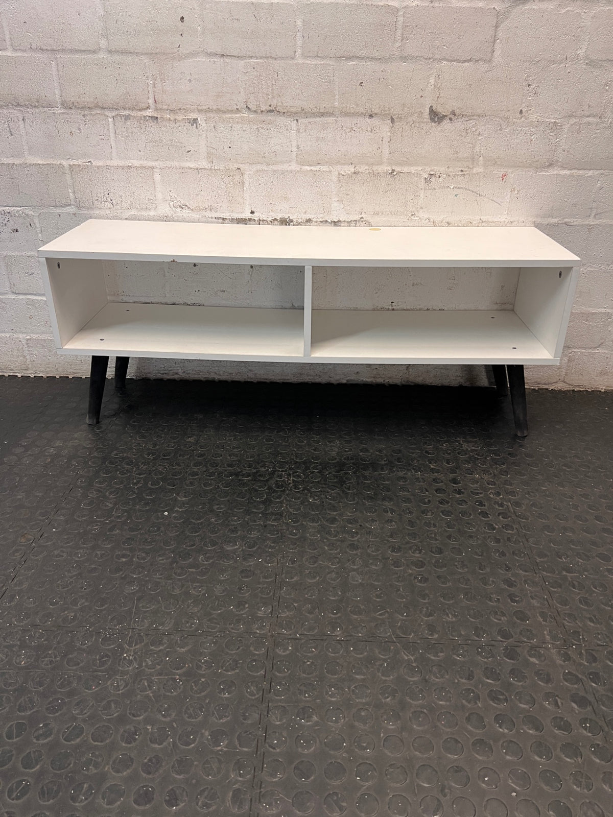 Low-Profile White TV Unit with Tapered Legs — Fair Condition With Visible Wear – back view