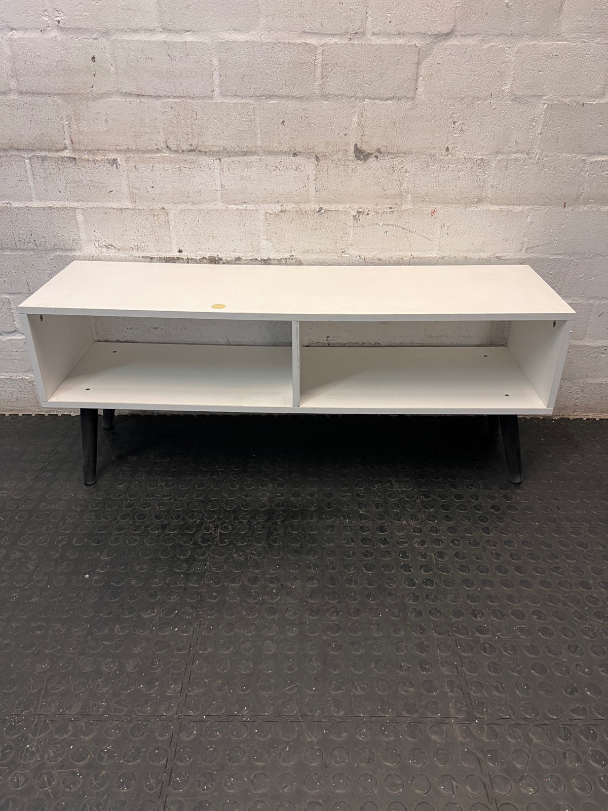 Low-Profile White TV Unit with Tapered Legs — Fair Condition With Visible Wear – side view