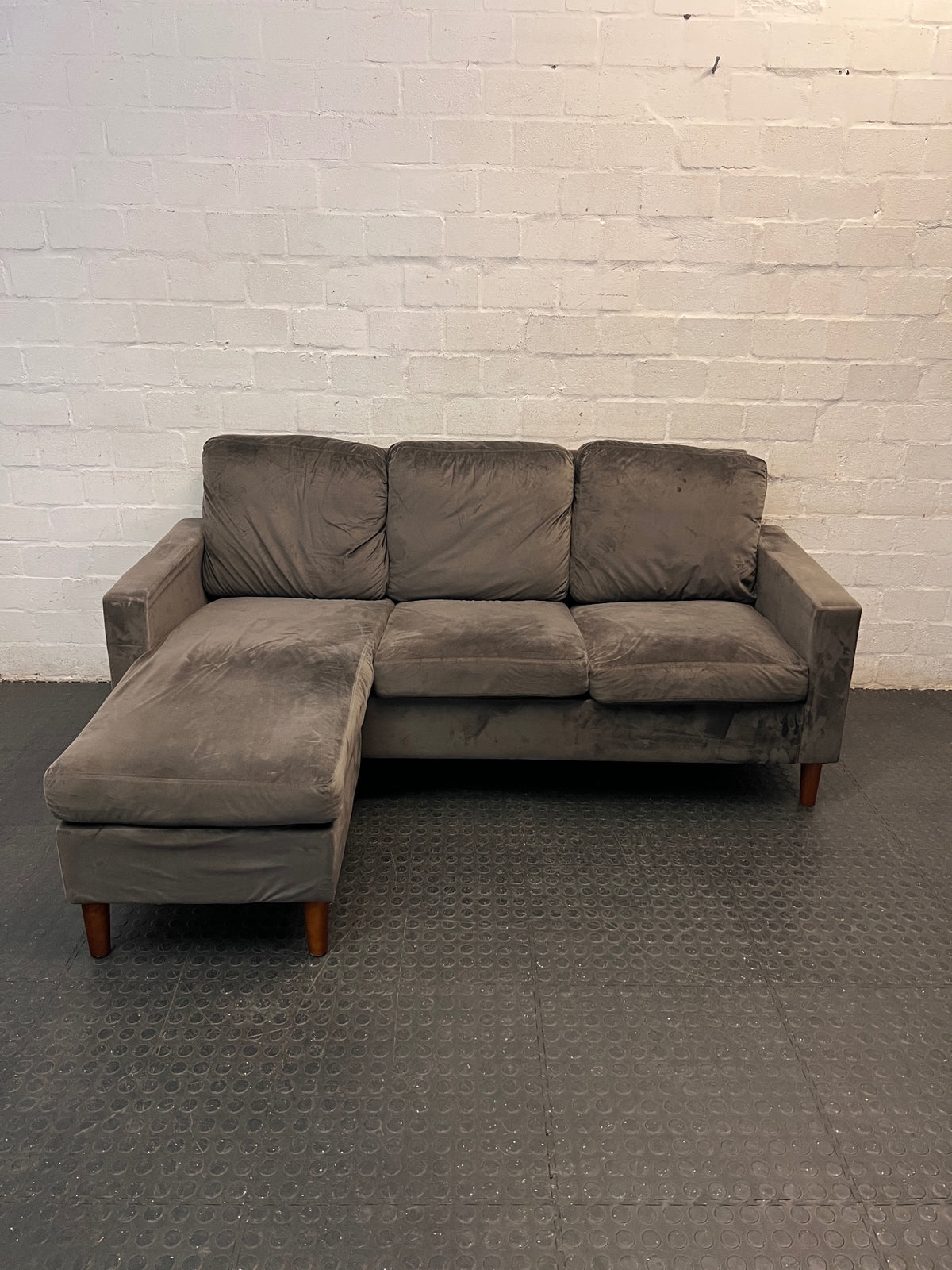 Grey Velvet-Style L-Shape Couch with Tapered Wooden Legs — Well Used Condition – main front view