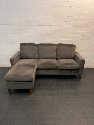 Grey Velvet-Style L-Shape Couch with Tapered Wooden Legs — Well Used Condition – main front view