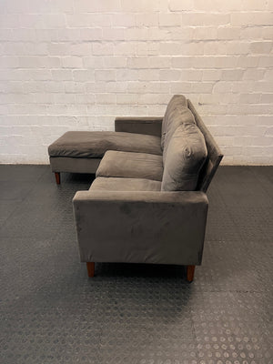 Grey Velvet-Style L-Shape Couch with Tapered Wooden Legs — Well Used Condition – side view