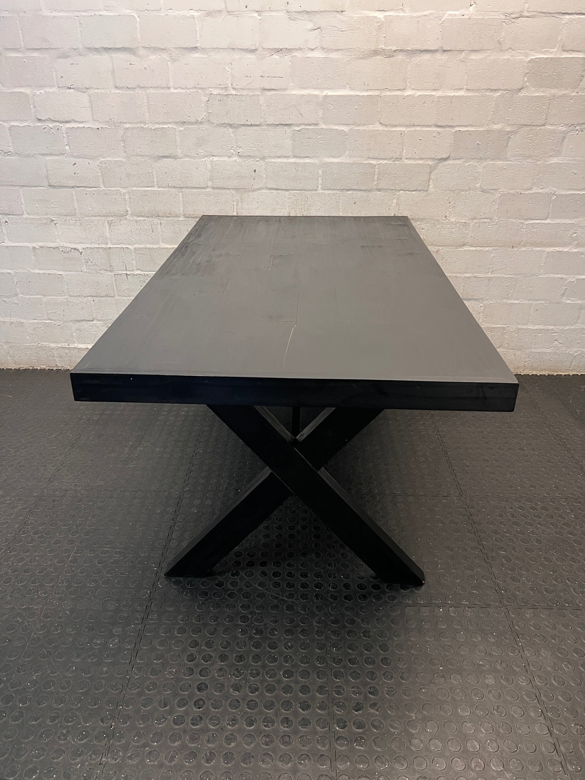 Dark Trestle-Style Wooden Dining Table — Crack on Top and Surface Scratches – side view