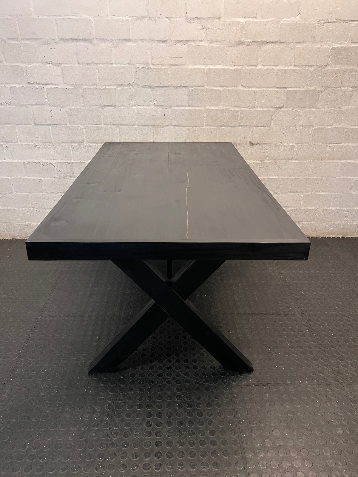 Dark Trestle-Style Wooden Dining Table — Crack on Top and Surface Scratches – top view