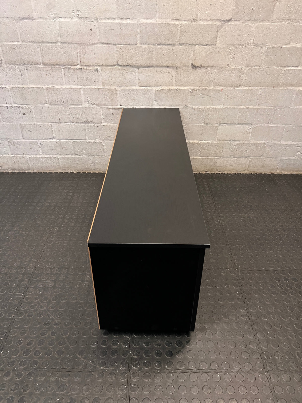 Black Low-Profile TV Unit with Cupboard and Shelving — Minor Surface Scratches – top view