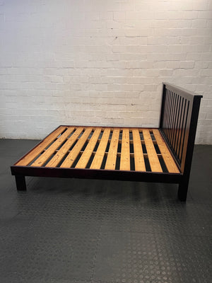 King Size Wooden Bed Frame with Slatted Headboard — Worn Mattress with Visible Marks; Bed Frame Good state – side view
