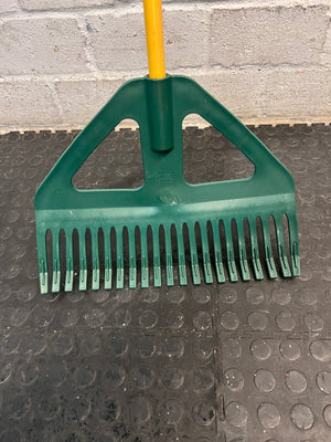 Plastic Leaf Rake with Long Yellow Handle – back view