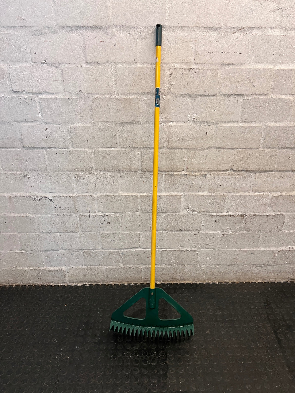 Plastic Leaf Rake with Long Yellow Handle – side view