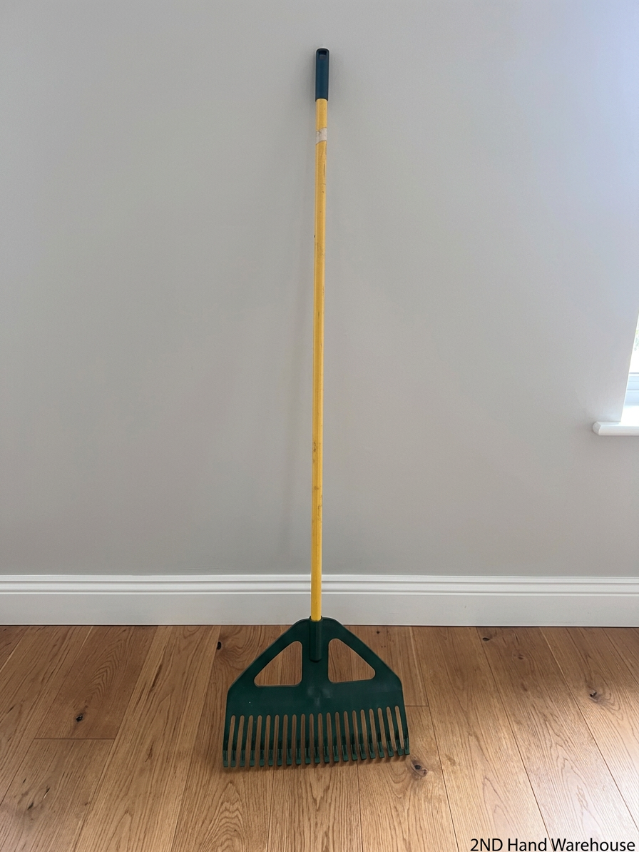 Plastic Leaf Rake with Long Yellow Handle – styled product image