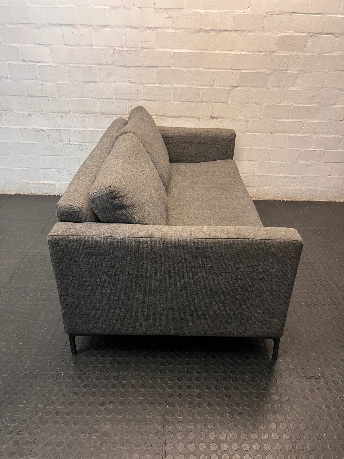 Coricraft Dark Grey 2 Seater Couch — Worn Fabric and Internal Squeak – back view