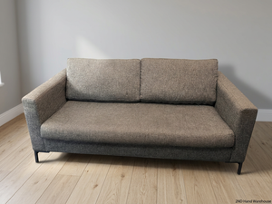 Coricraft Dark Grey 2 Seater Couch — Worn Fabric and Internal Squeak – styled product image