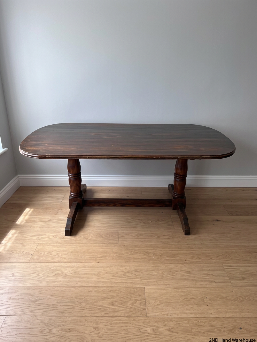 Rounded Brown Timber Dining Table with Pedestal Base — Visible Wear on Tabletop – styled product image