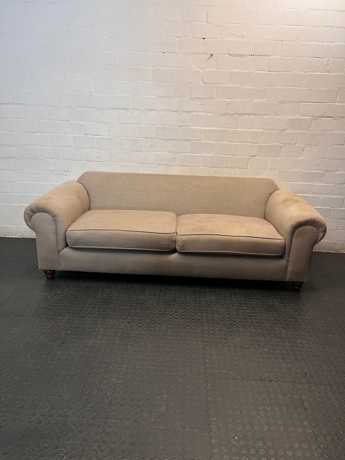 Grey Upholstered Two-Seater Couch with Rolled Arms — Good to Fair Condition with Marks on Armrest – main front view