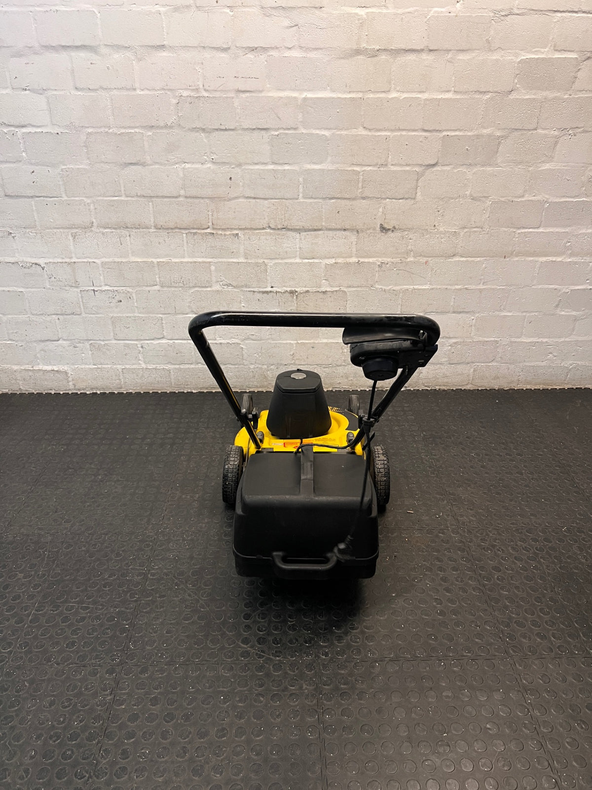 Electric Rotary Lawnmower in Yellow and Black — Trips Power Supply; Non-Functional – condition detail
