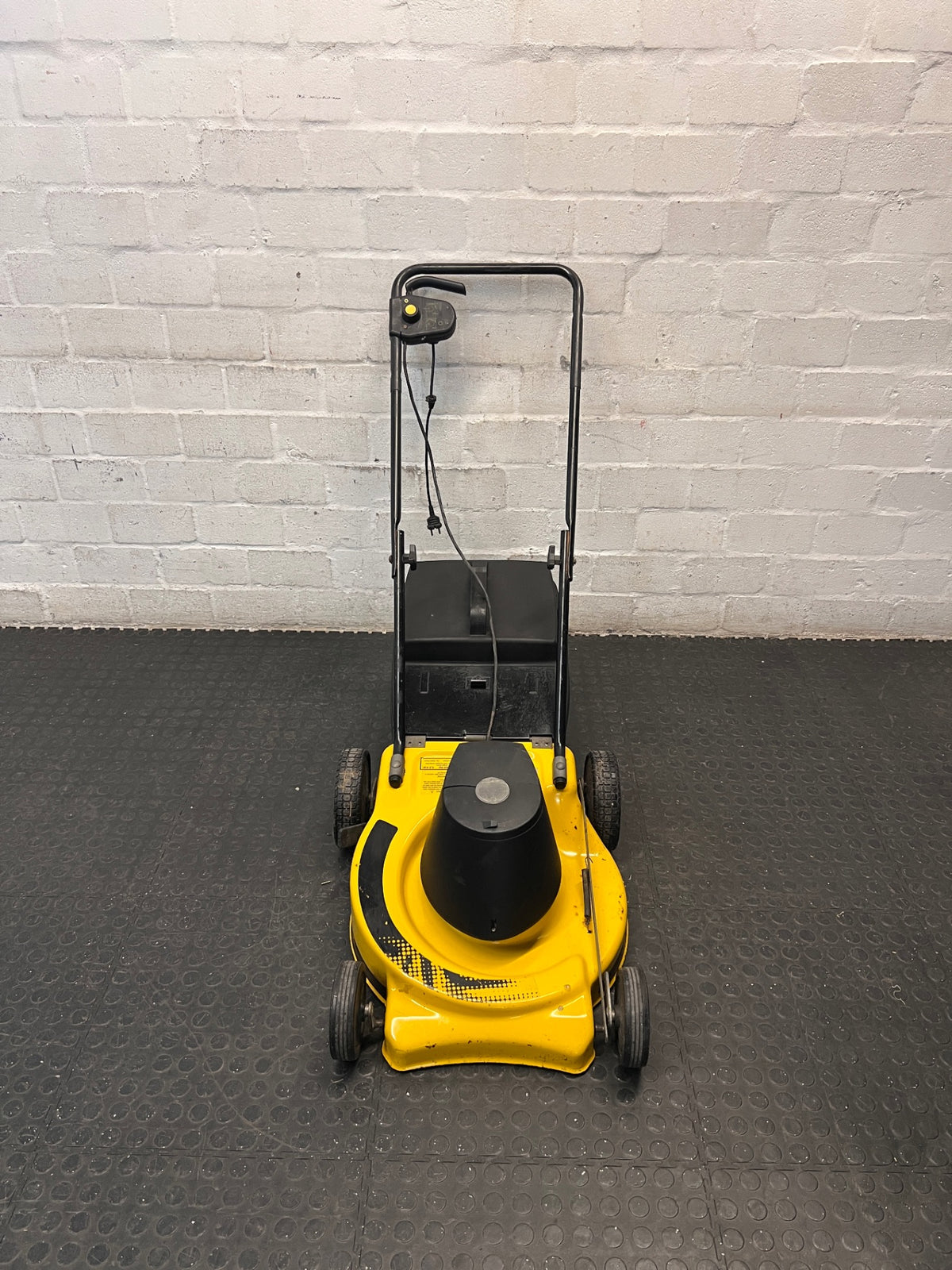 Electric Rotary Lawnmower in Yellow and Black — Trips Power Supply; Non-Functional – main front view
