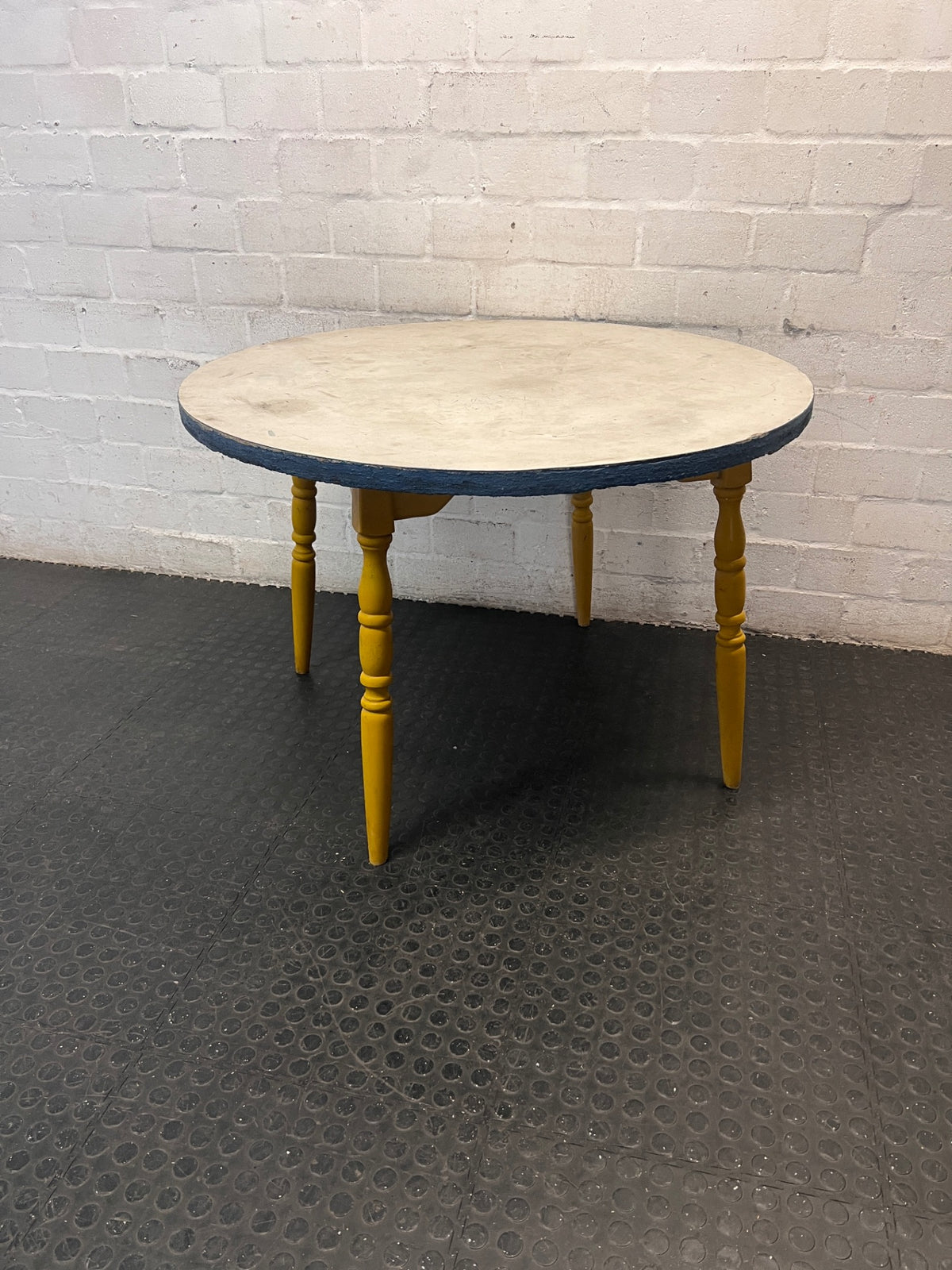 Round Yellow Wood Outdoor Table with Blue Trim — Visible Wear and Surface Staining – main front view