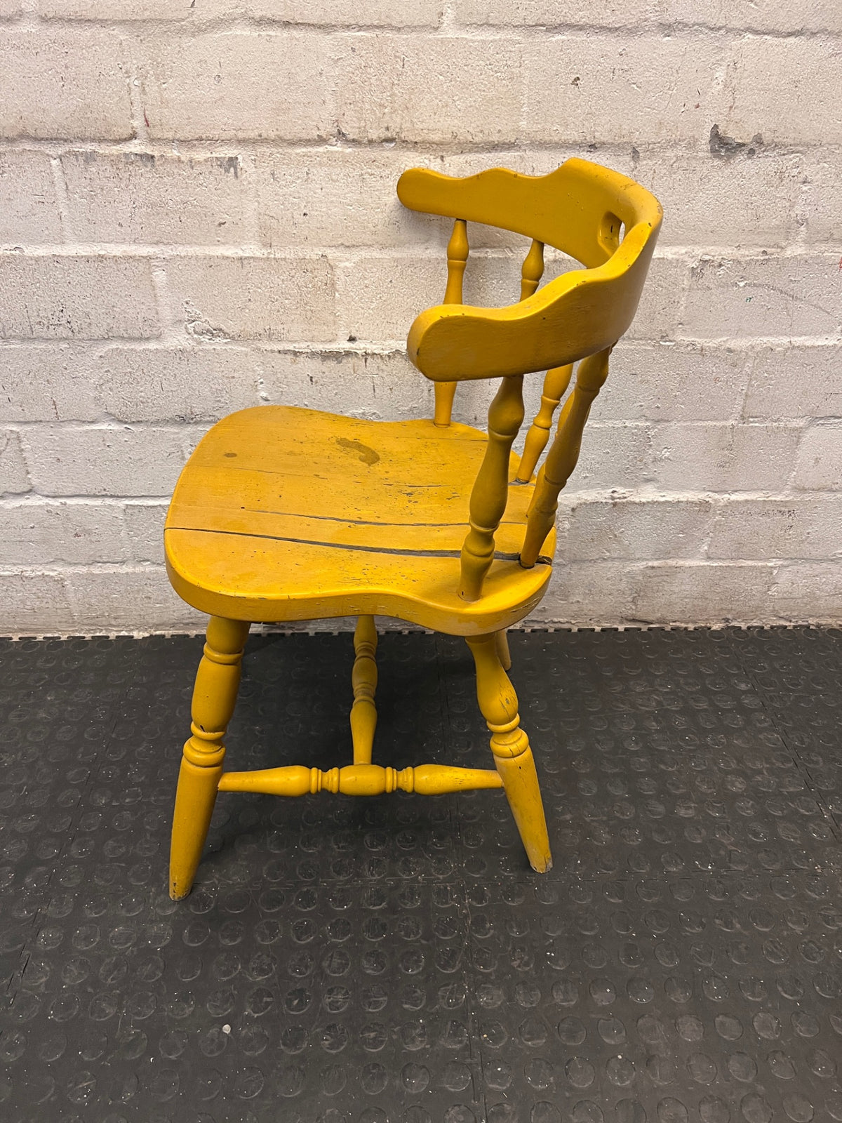 Yellow Farmhouse Style Wooden Outdoor Chair — Cracked Seat and Worn Paintwork – side view
