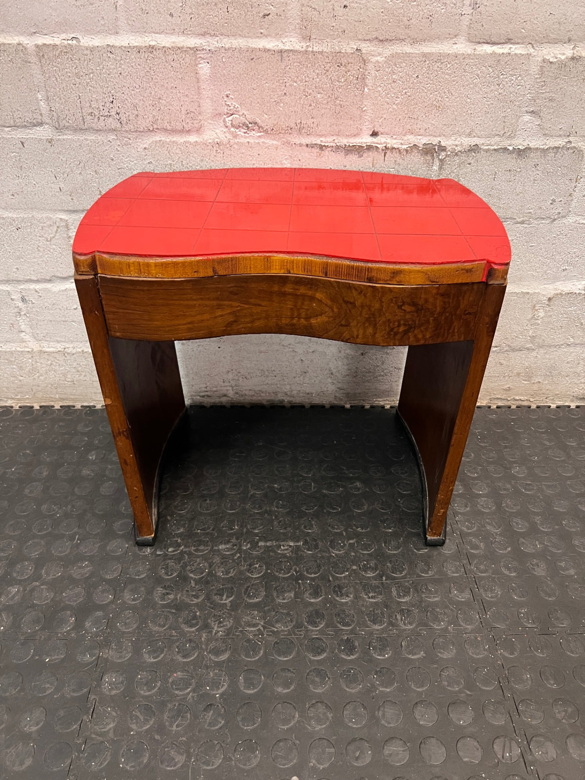 Curved Wooden Stool with Tiled Red Top — Fair Used Condition with Surface Wear – back view