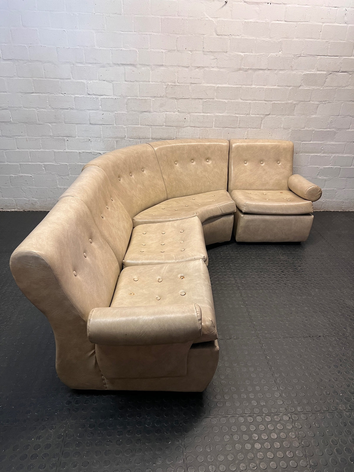 Beige L-Shape Curved Upholstered Corner Couch — Sagging Seats, Thin Padding, and Missing Buttons – side view