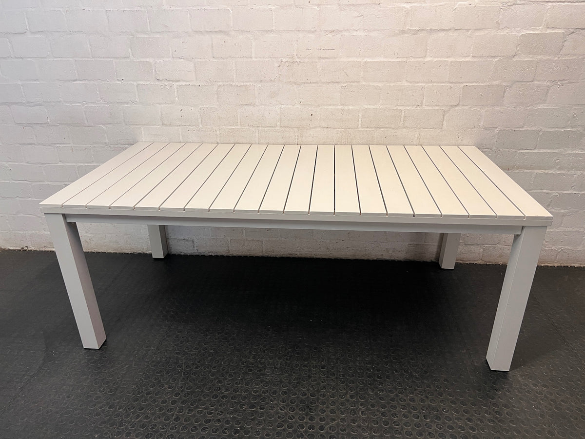 Cream Slatted Metal Outdoor Table — Well Used with General Outdoor Wear – condition detail