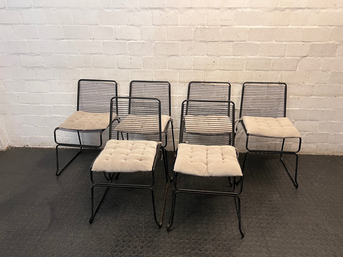 Black Steel Frame Dining Chair with Beige Cushion — Well Used State – side view