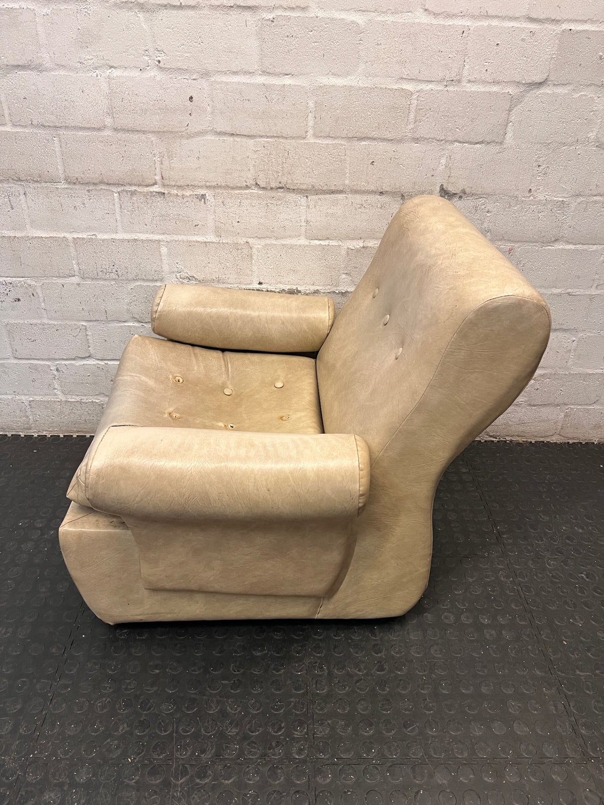 Beige Button-Tufted One Seater Couch with Bolster Arms — Damaged Upholstery and Missing Buttons – side view
