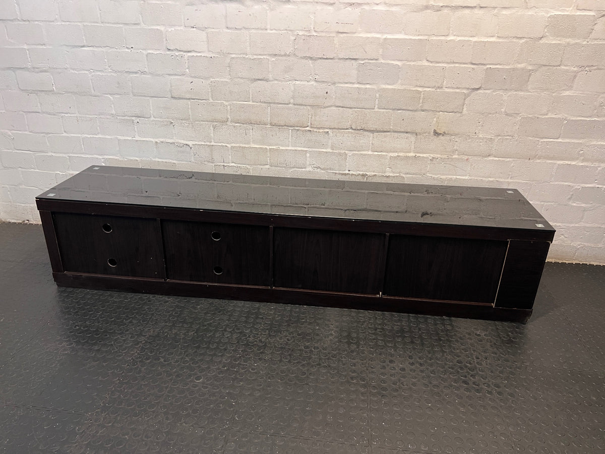 Sleek Black Glass-Top TV Unit with Storage — Good Working Order – top view