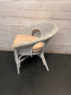 White Wicker Armchair with Striped Cushion — Wicker Coming Undone on Chair Back – side view