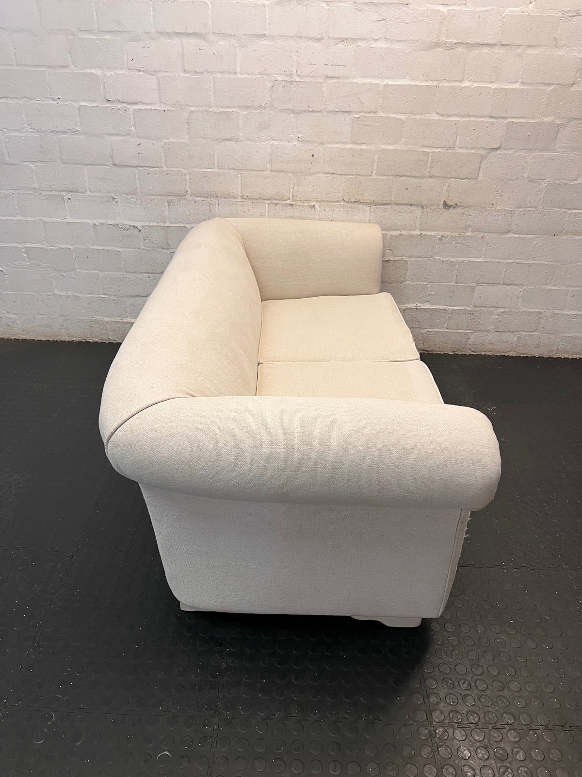 Cream Upholstered 2 Seater Couch with Rolled Arms — Slight Cat Claw Marks on Upholstery – back view