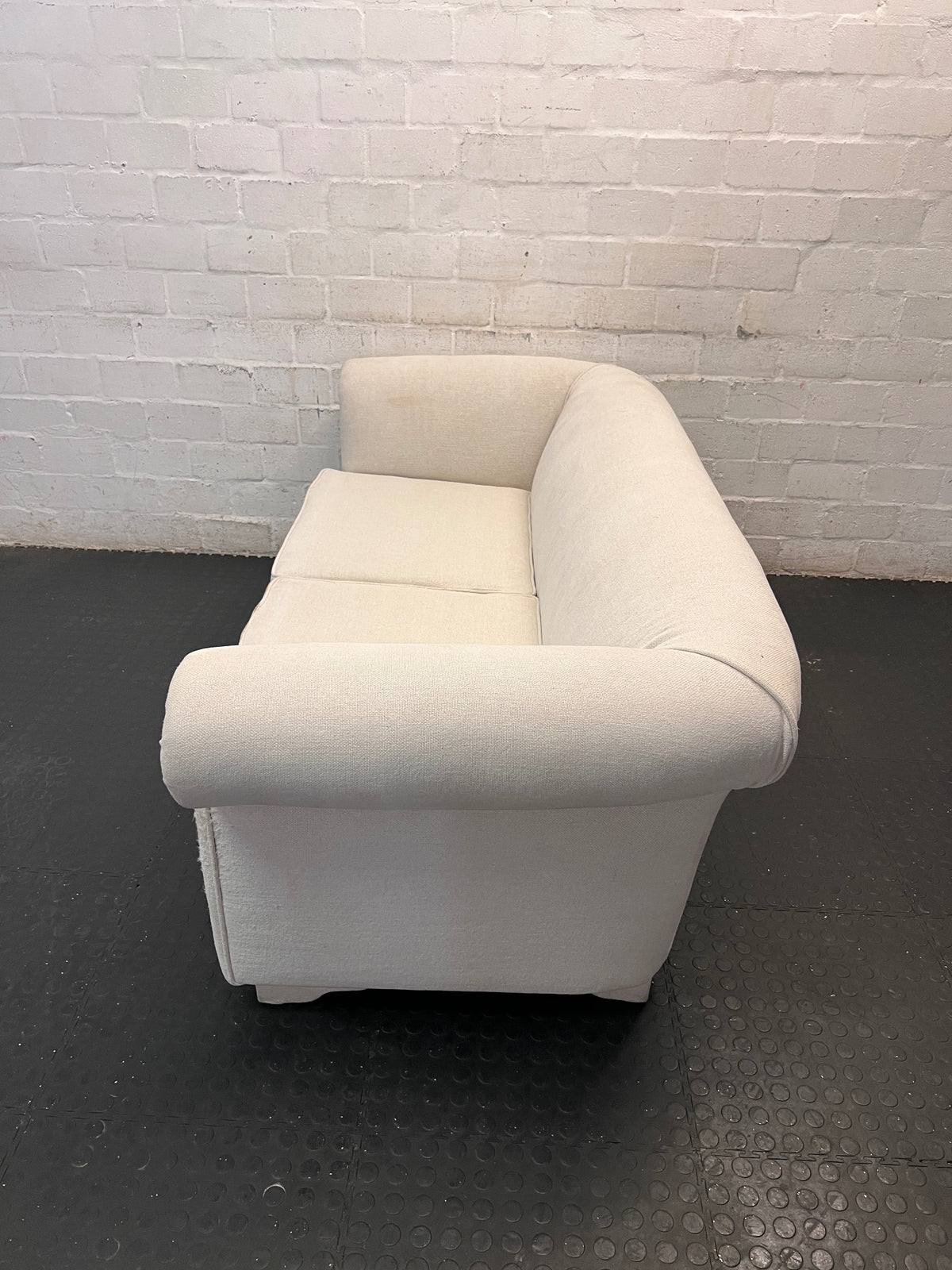 Cream Upholstered 2 Seater Couch with Rolled Arms — Slight Cat Claw Marks on Upholstery – side view