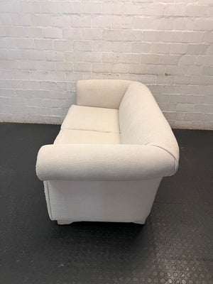 Cream Upholstered 2 Seater Couch with Rolled Arms — Slight Cat Claw Marks on Upholstery – side view