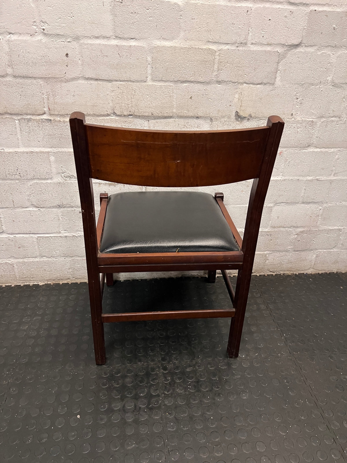 Vintage-Style Wooden Dining Chair with Black Padded Seat — Well Used Condition – back view